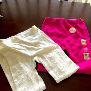 Two pairs of pink and white leggings